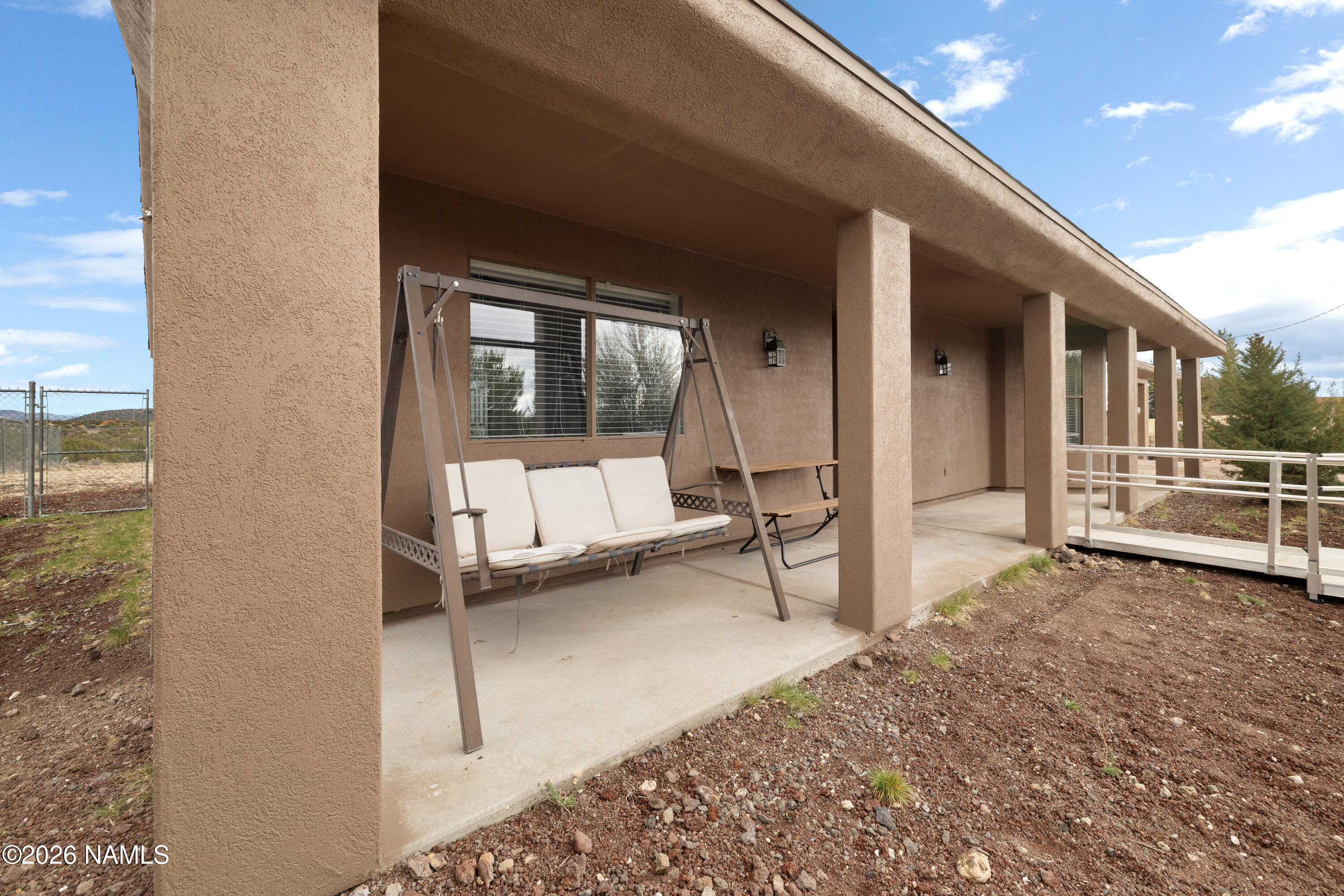 3097 Whitetail Loop Williams, AZ 86046 - Photo 32 of 46 Enjoy Your Covered Porch and a Swing