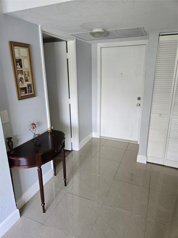 9400 Live Oak Place, Unit 305 Davie, FL 33324 - Photo 14 of 93 a room with table and chair