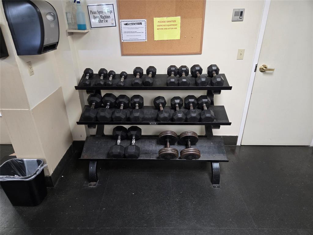 9400 Live Oak Place, Unit 305 Davie, FL 33324 - Photo 53 of 93 a table with wine bottles and chairs in it