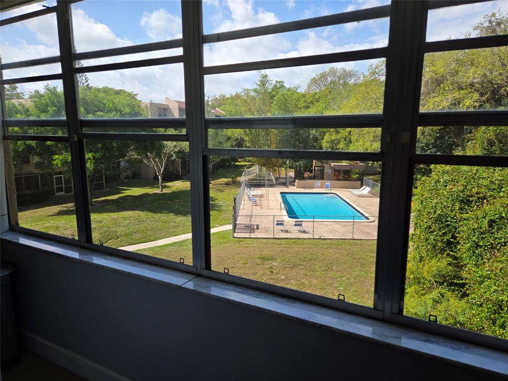 9400 Live Oak Place, Unit 305 Davie, FL 33324 - Photo 8 of 93 Overlookig The Swimming Pool.