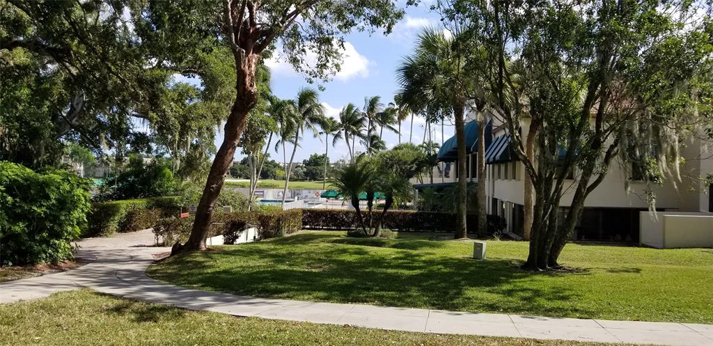 9400 Live Oak Place, Unit 305 Davie, FL 33324 - Photo 83 of 93 Back Entrance to The Heated Swimming Pool And Chippers.