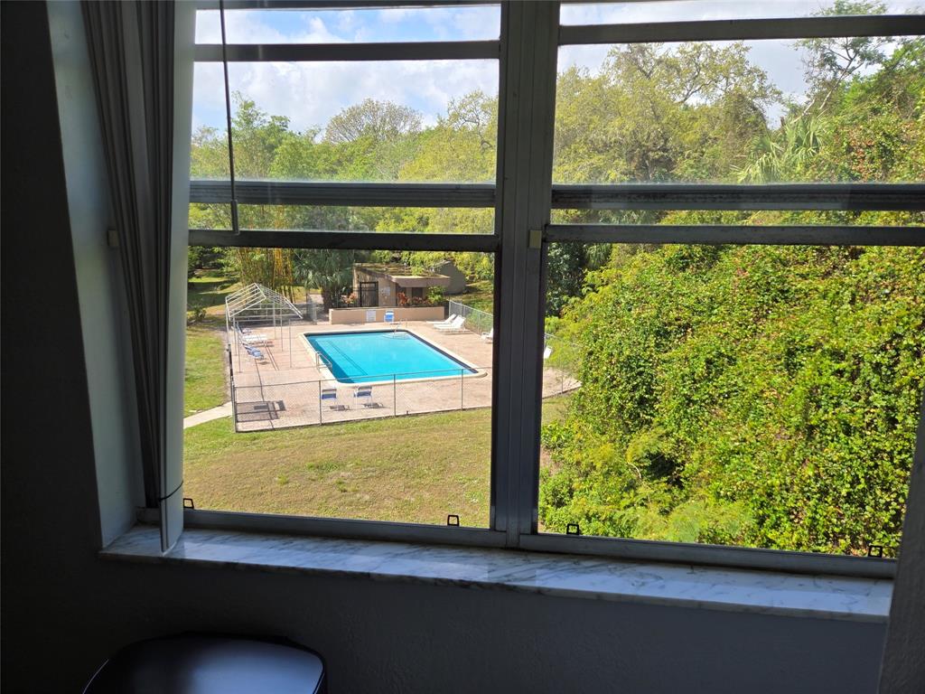 9400 Live Oak Place, Unit 305 Davie, FL 33324 - Photo 9 of 93 a view of a blue and top of a window