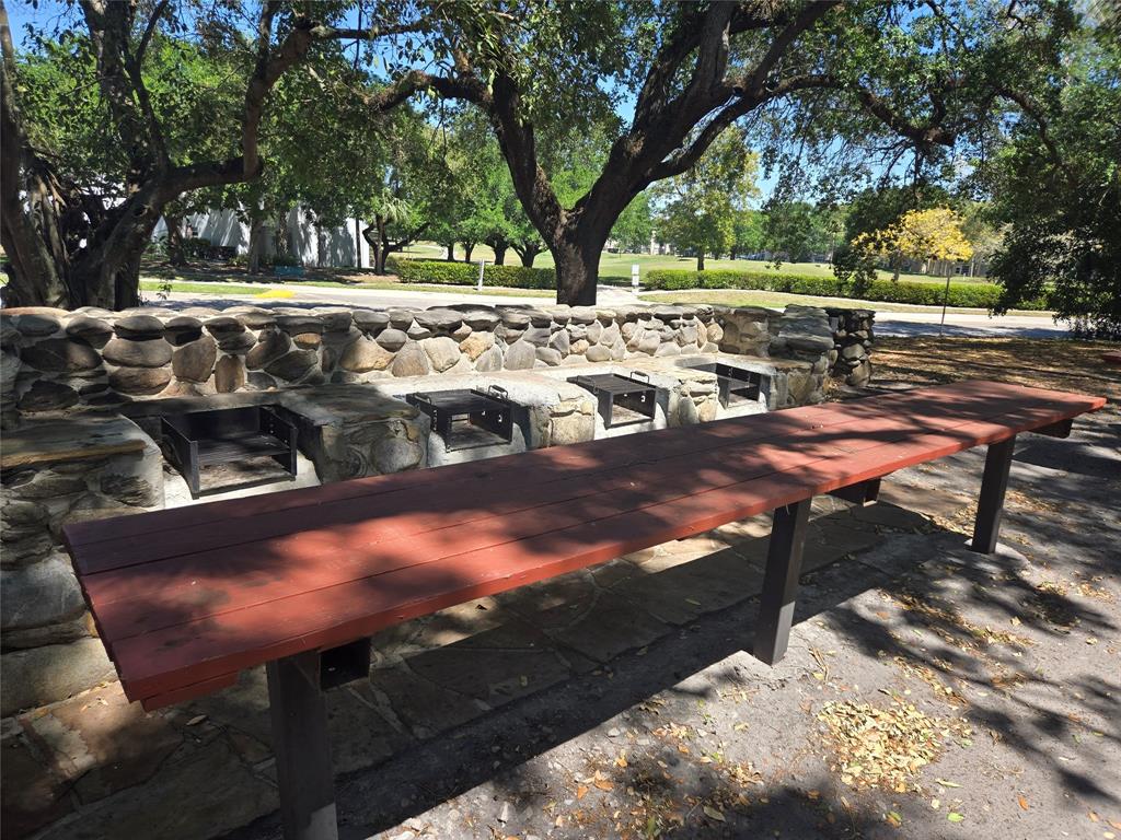 9400 Live Oak Place, Unit 305 Davie, FL 33324 - Photo 91 of 93 a view of a yard with lawn chairs and a fire pit