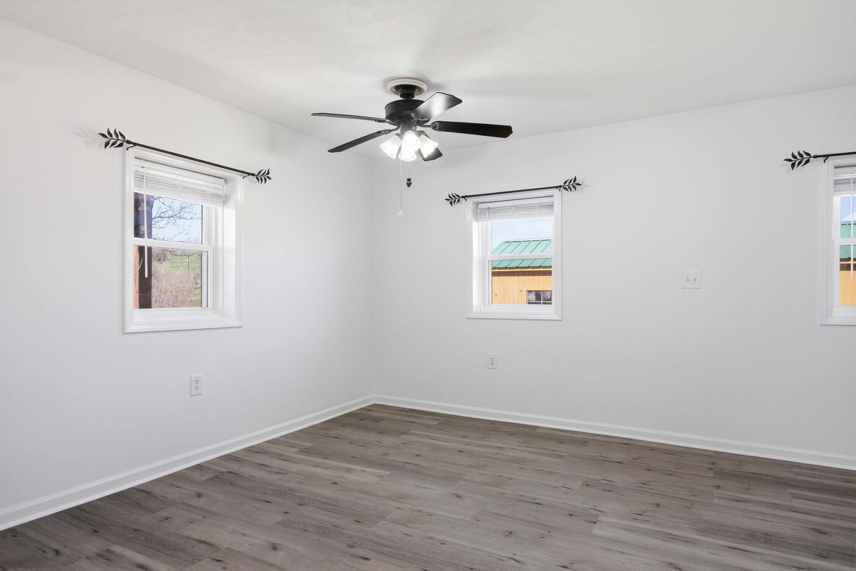 6458 Piney Woods Road Riner, VA 24149 - Photo 6 of 50 a view of empty room with wooden floor