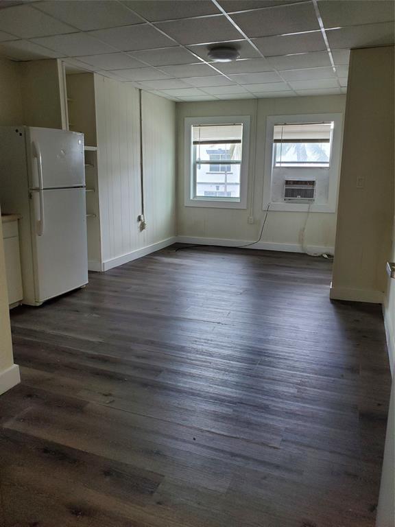 50 North Federal Highway, Unit 4 Dania Beach, FL 33004 - Photo 13 of 22 an empty room with wooden floor and windows
