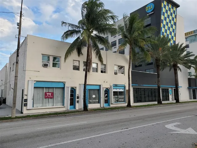 a view of hallway with wooden floor