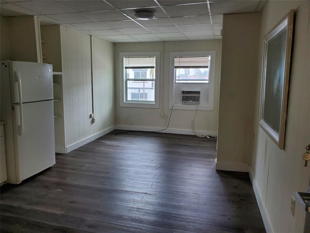 50 North Federal Highway, Unit 4 Dania Beach, FL 33004 - Photo 2 of 22 an empty room with wooden floor and a window