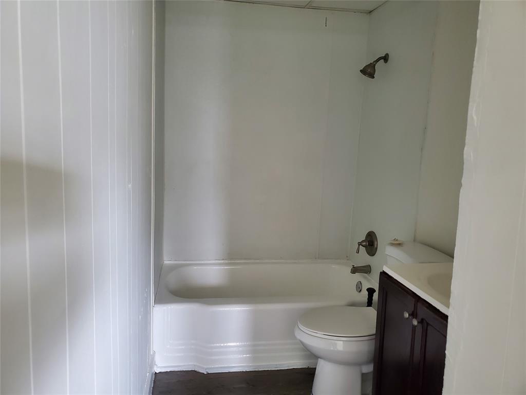 50 North Federal Highway, Unit 4 Dania Beach, FL 33004 - Photo 5 of 22 a bathroom with a sink and a toilet