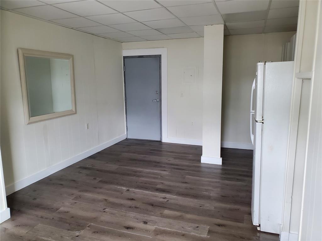 50 North Federal Highway, Unit 4 Dania Beach, FL 33004 - Photo 6 of 22 a view of an empty room with wooden floor and a bathroom