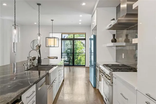 a kitchen with sink and stove