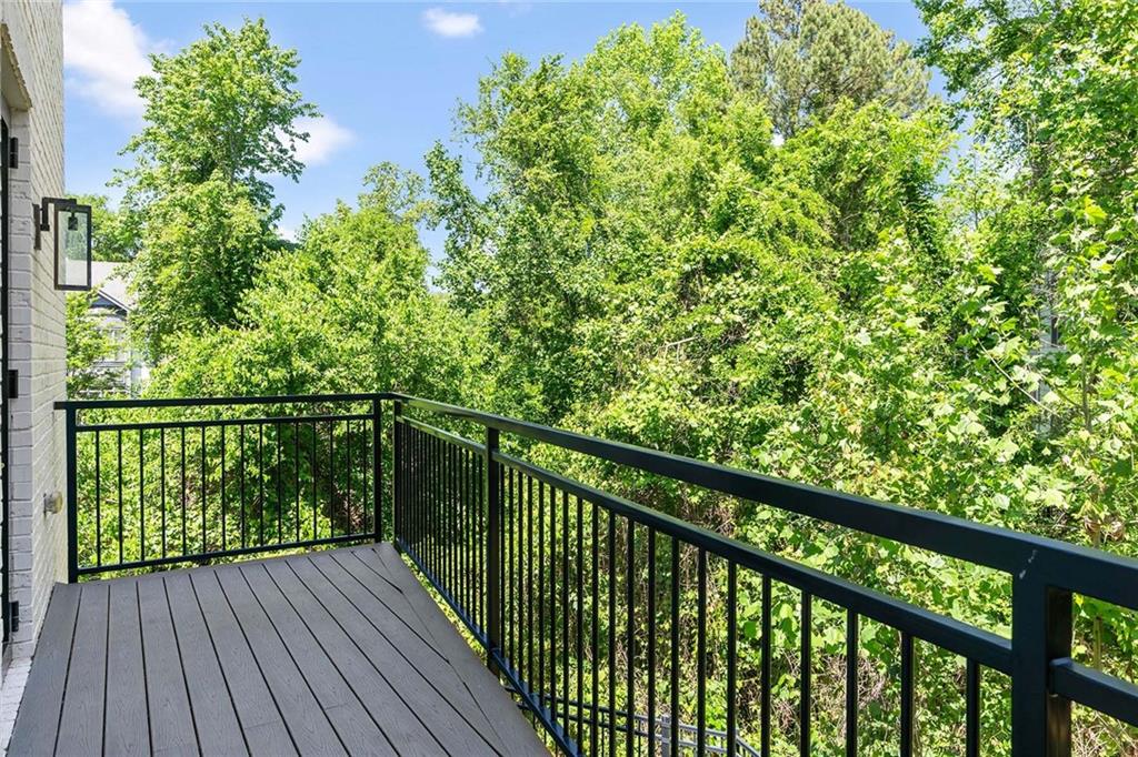 914 Lenox Boulevard Atlanta, GA 30324 - Photo 17 of 48 a view of a balcony with wooden floor