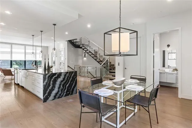 a view of a dining room with furniture window and wooden floor