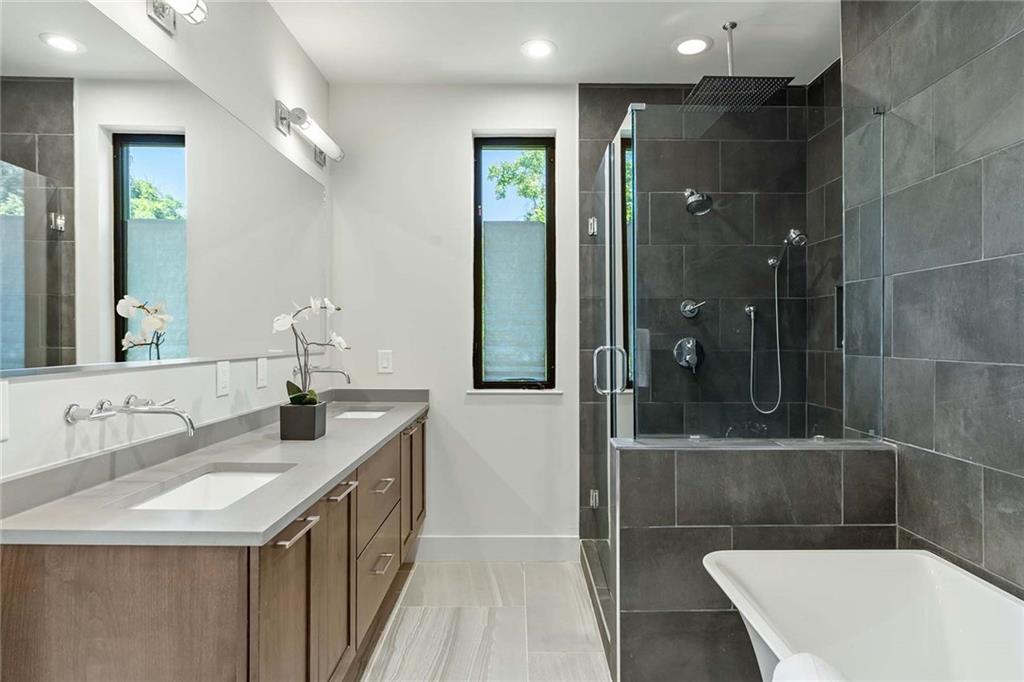 914 Lenox Boulevard Atlanta, GA 30324 - Photo 27 of 48 a bathroom with a sink and a mirror