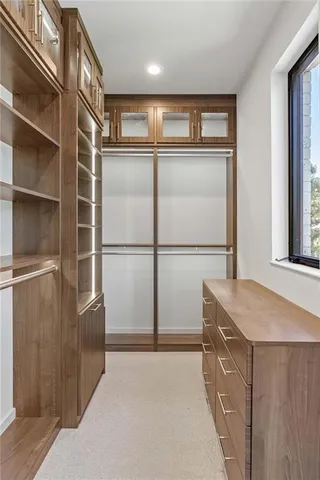 a view of an empty room with a ceiling fan