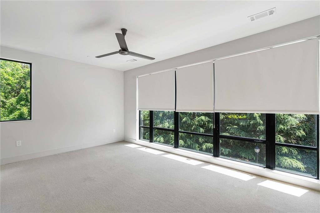 914 Lenox Boulevard Atlanta, GA 30324 - Photo 29 of 48 a view of an empty room with a balcony
