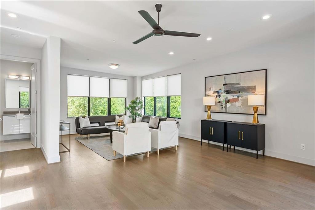 914 Lenox Boulevard Atlanta, GA 30324 - Photo 34 of 48 a living room with furniture and a large window