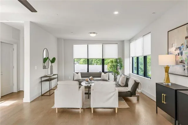 a living room with furniture and a large window