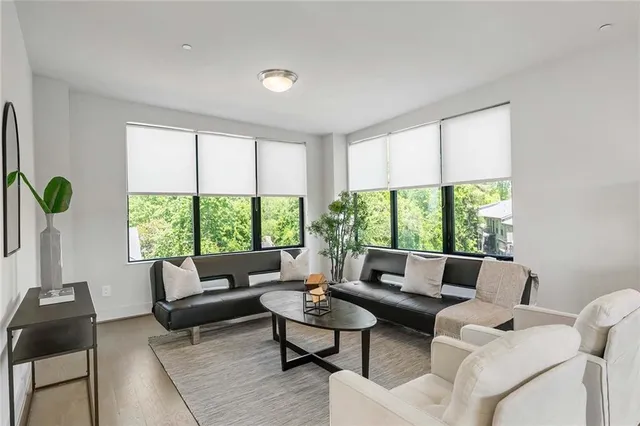 a view of a room with a large window and an outdoor view