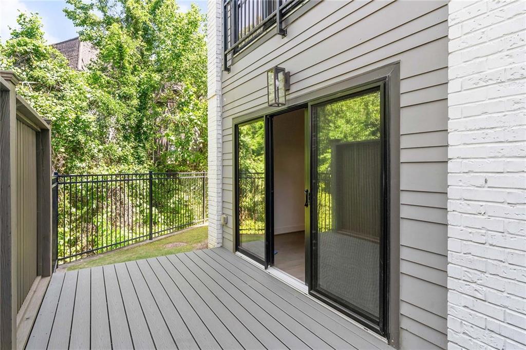 914 Lenox Boulevard Atlanta, GA 30324 - Photo 45 of 48 a view of backyard with large windows and wooden floor