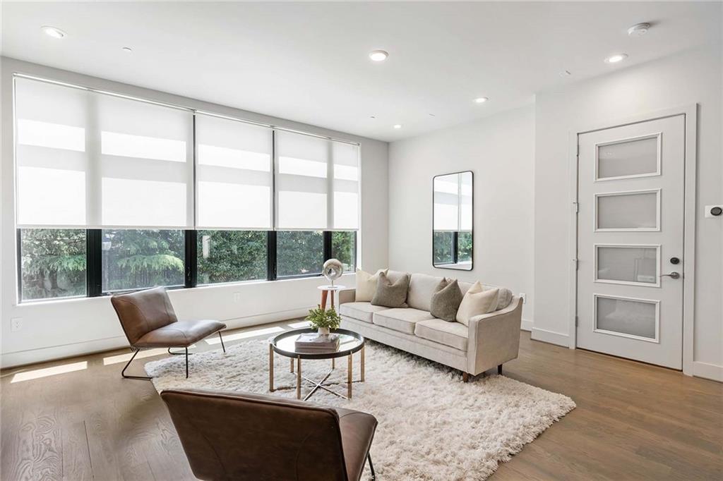 914 Lenox Boulevard Atlanta, GA 30324 - Photo 6 of 48 a living room with furniture and a large window