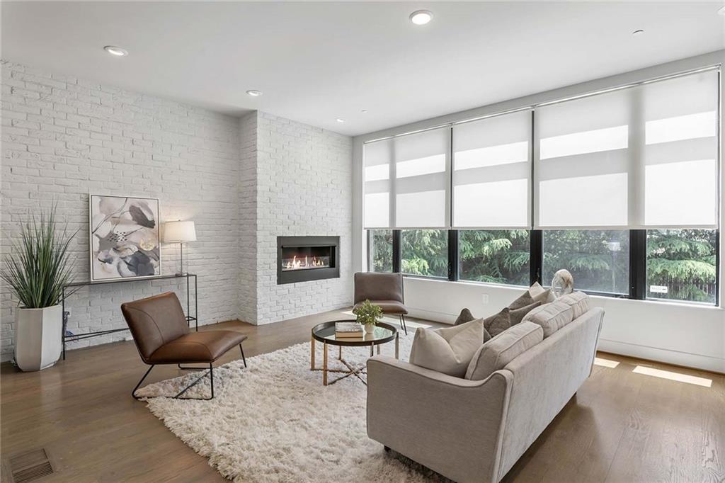 914 Lenox Boulevard Atlanta, GA 30324 - Photo 7 of 48 a living room with furniture and a large window