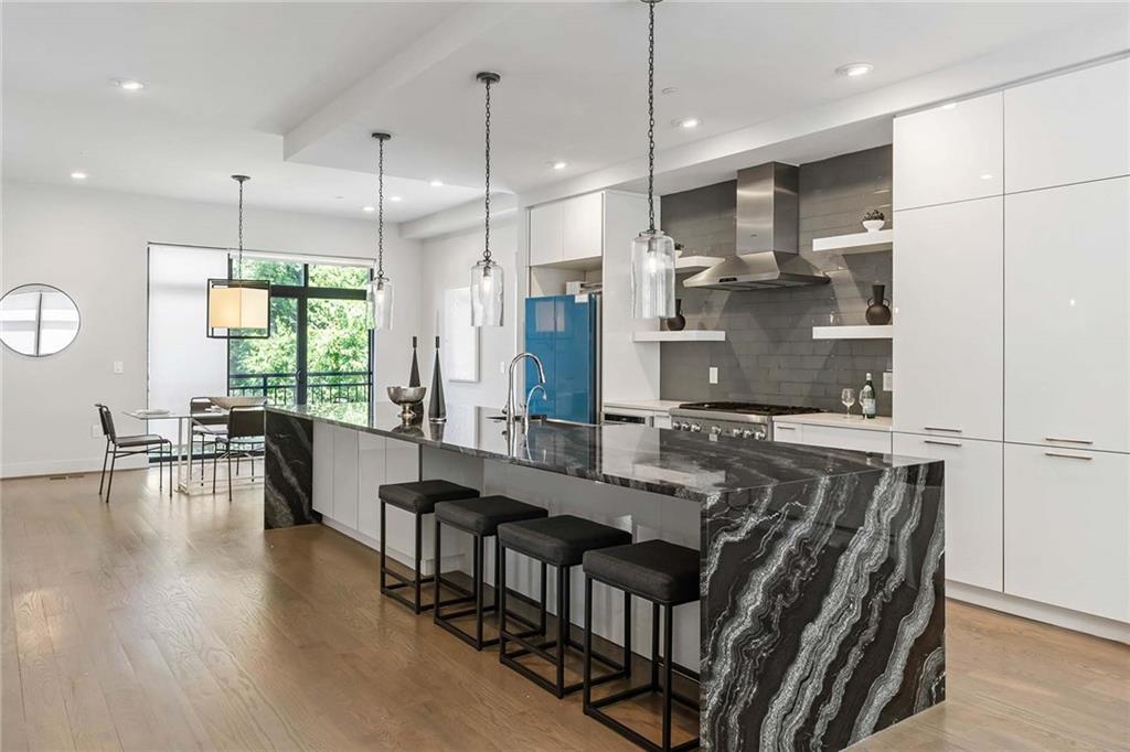 914 Lenox Boulevard Atlanta, GA 30324 - Photo 9 of 48 a large kitchen with kitchen island a large island in it