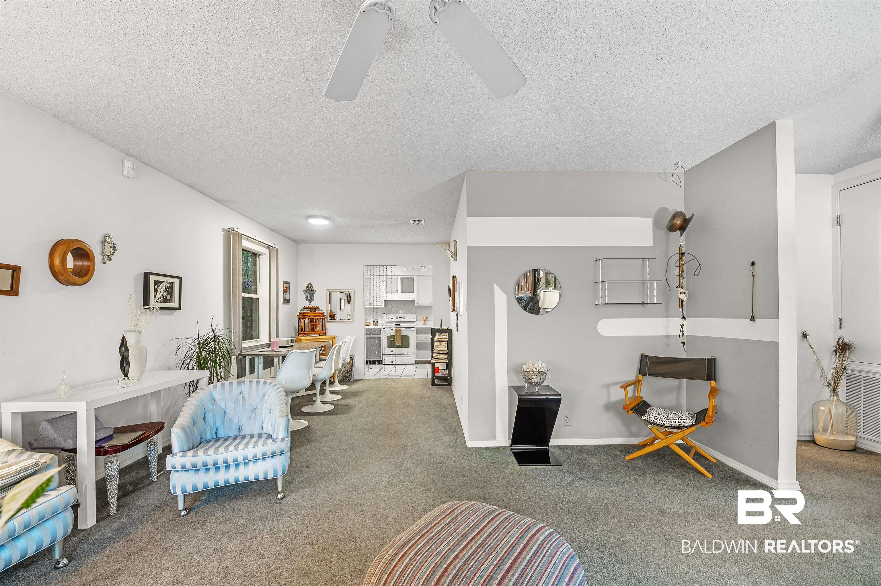 526 Ariel Avenue Foley, AL 36535 - Photo 11 of 33 Living room featuring ceiling fan, carpet floors, and a textured ceiling