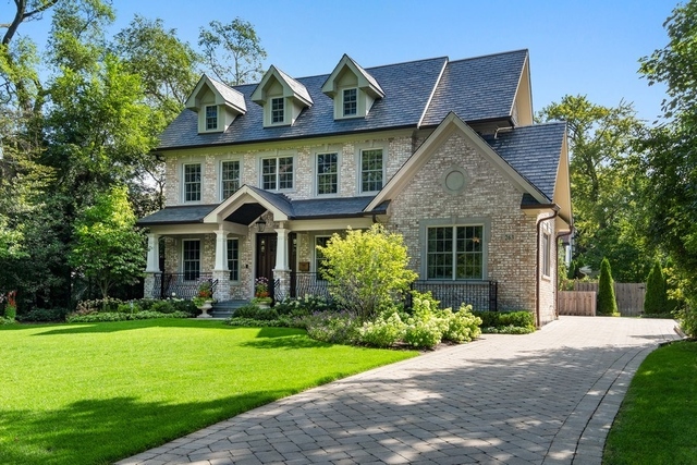 263 Chestnut Street Winnetka, IL 60093 - Photo 1 of 30 a front view of a house with garden