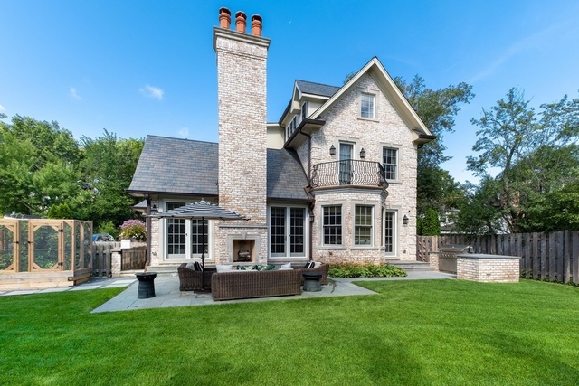 263 Chestnut Street Winnetka, IL 60093 - Photo 23 of 30 front view of a house with a yard