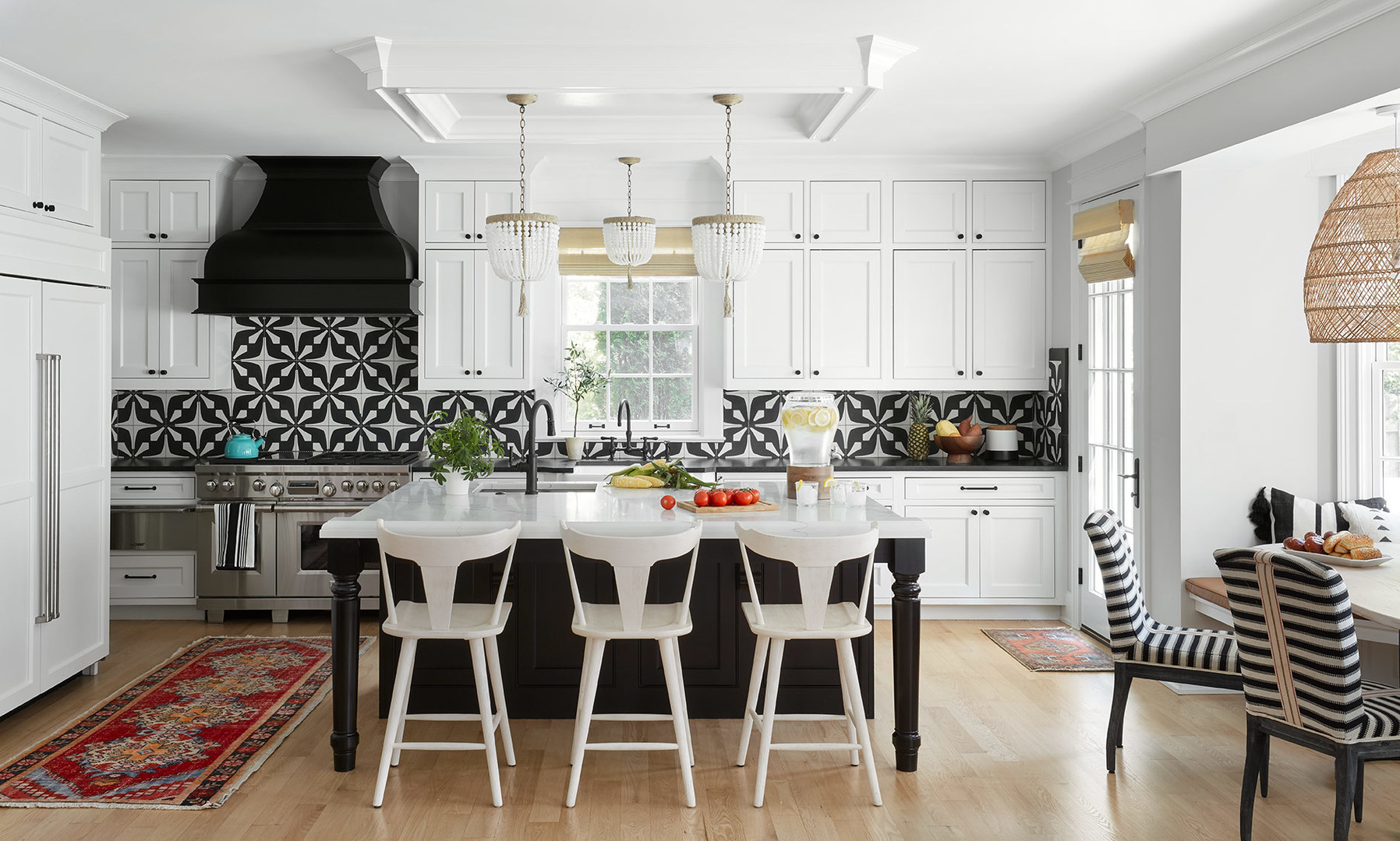 263 Chestnut Street Winnetka, IL 60093 - Photo 8 of 30 a kitchen with a table chairs stove and cabinets