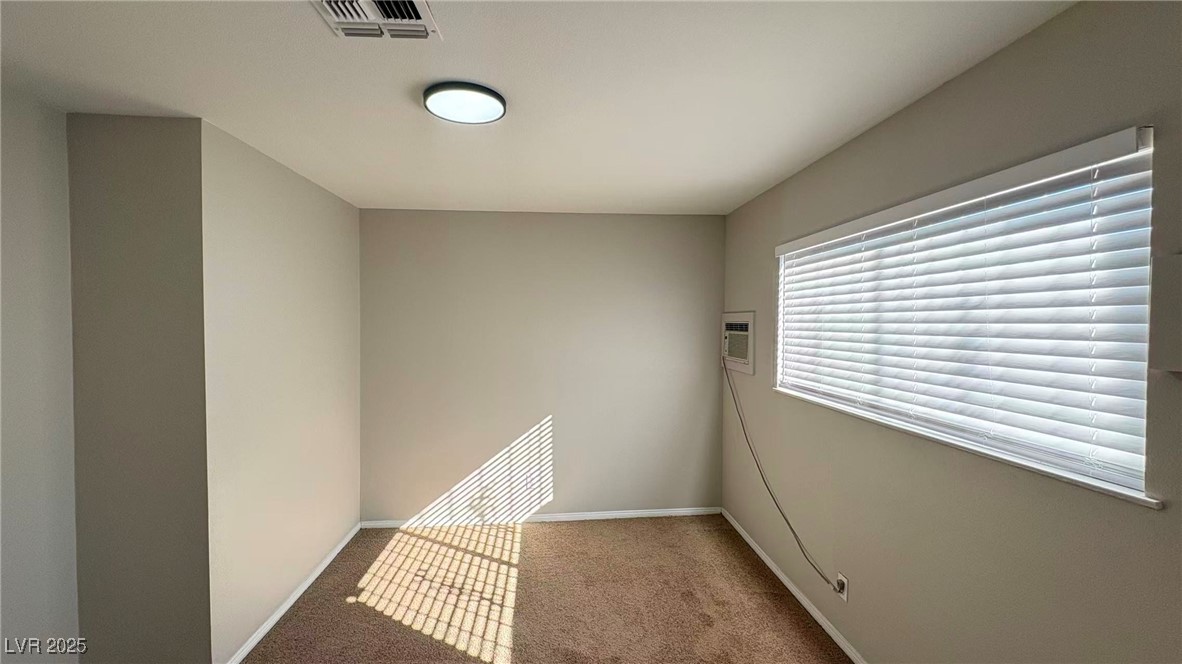 7113 Pinelake Road Las Vegas, NV 89145 - Photo 19 of 22 Carpeted empty room featuring baseboards
