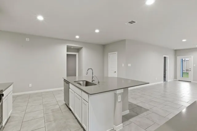 a hallway with dining table and chairs