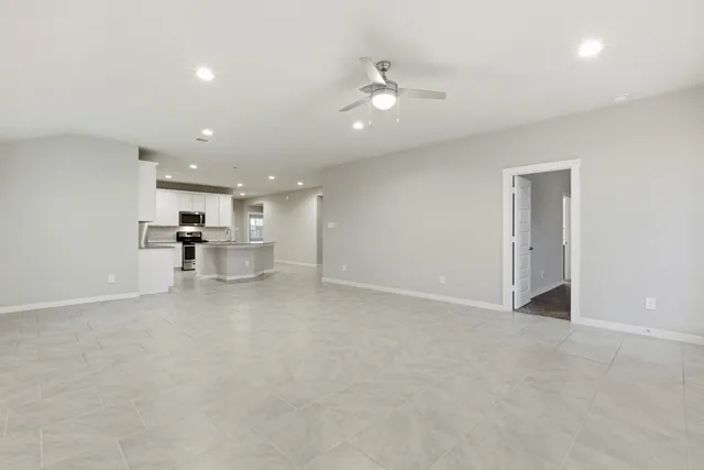 a view of kitchen with wooden floor and a window