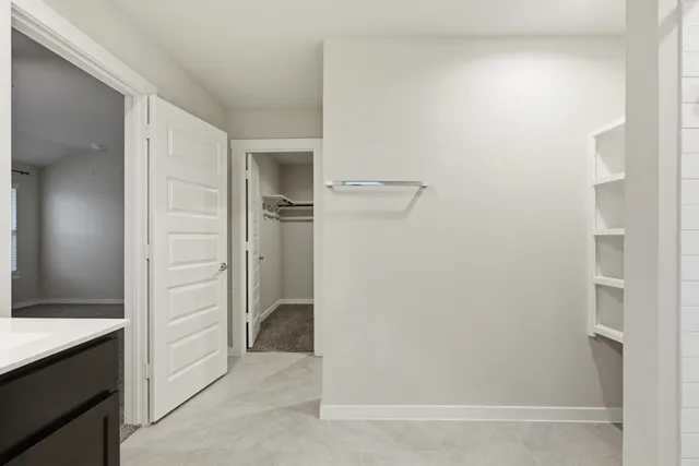 a view of a room with racks on the wall