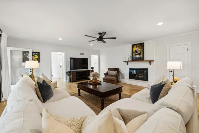 a living room with furniture and a window