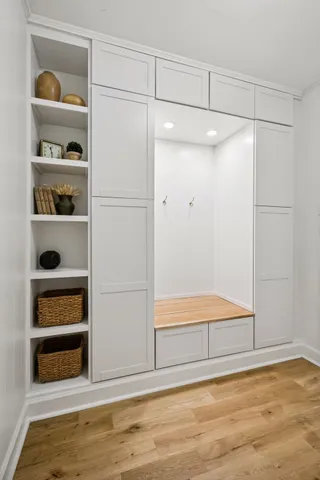 a bathroom with a sink a mirror and a shower