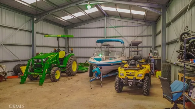 a view of a chairs and table in a patio