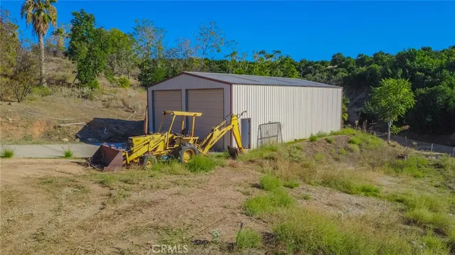 a view of backyard with a table and chairs