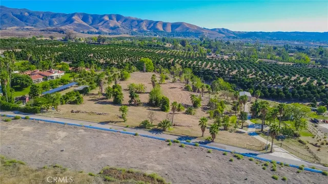 a view of a street with a building in the background