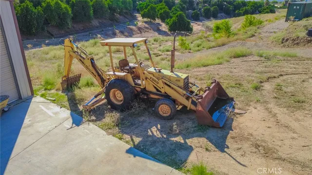 a view of a small yard with furniture