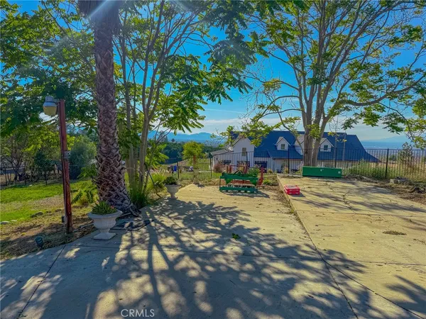 a view of a yard with swimming pool