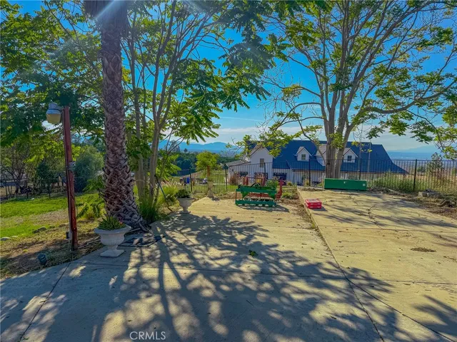 a view of a yard with swimming pool