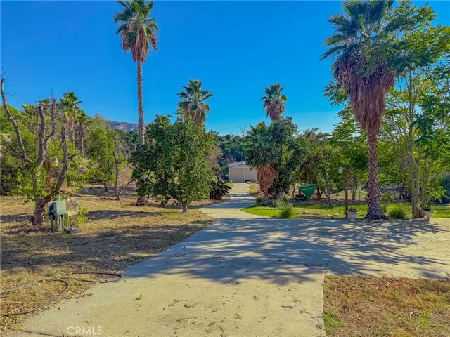 a view of a swimming pool with a yard