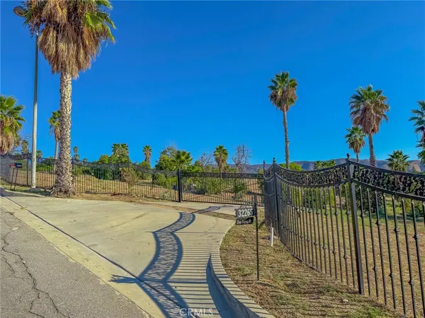 a view of a swimming pool with a table and chairs