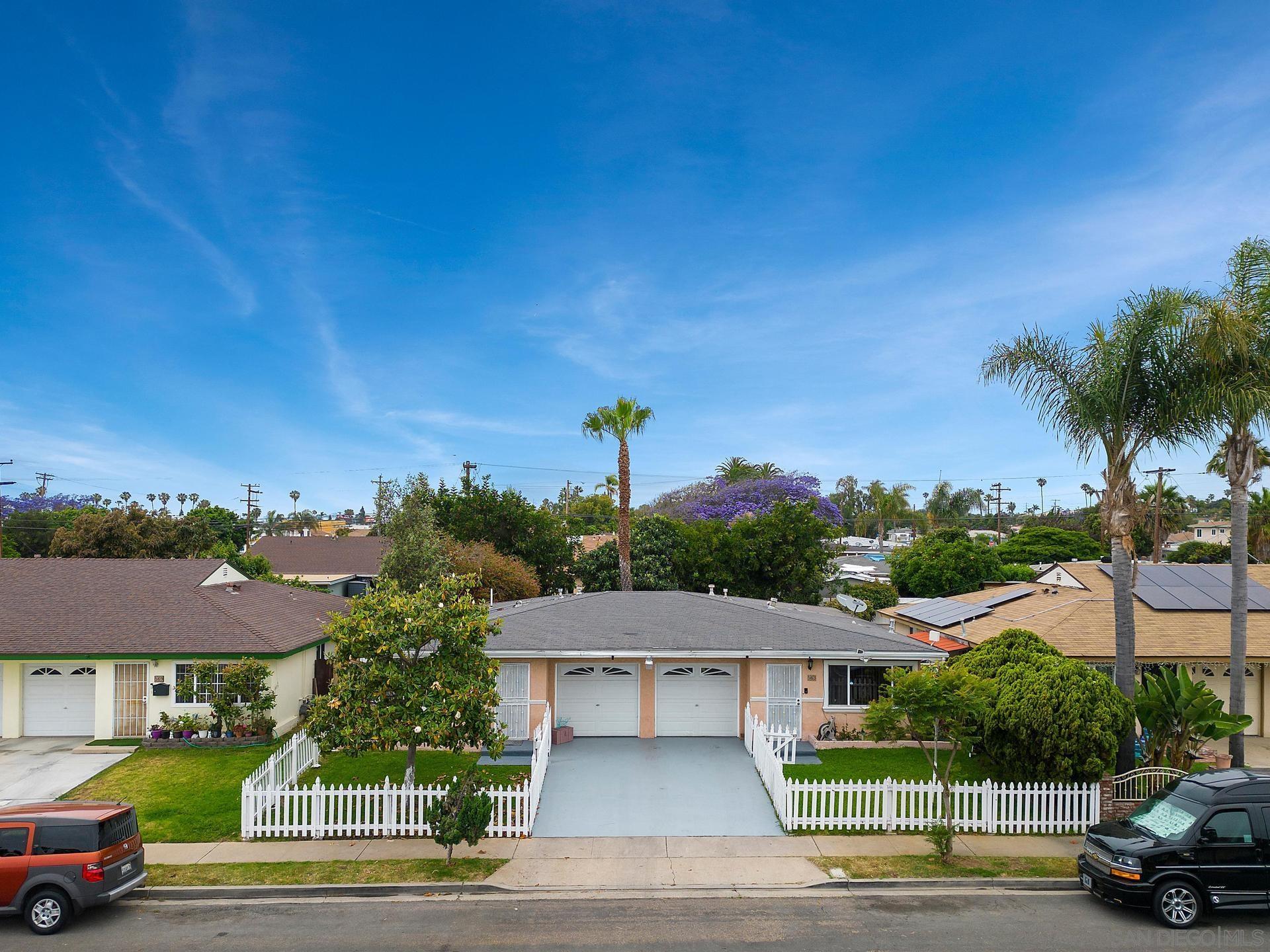 a view of a city street and trees