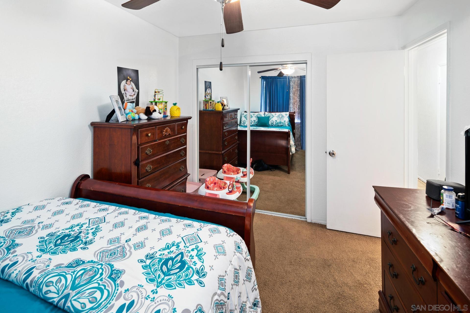 563 Madrona Street Chula Vista, CA 91910 - Photo 17 of 41 a bedroom with bed and window