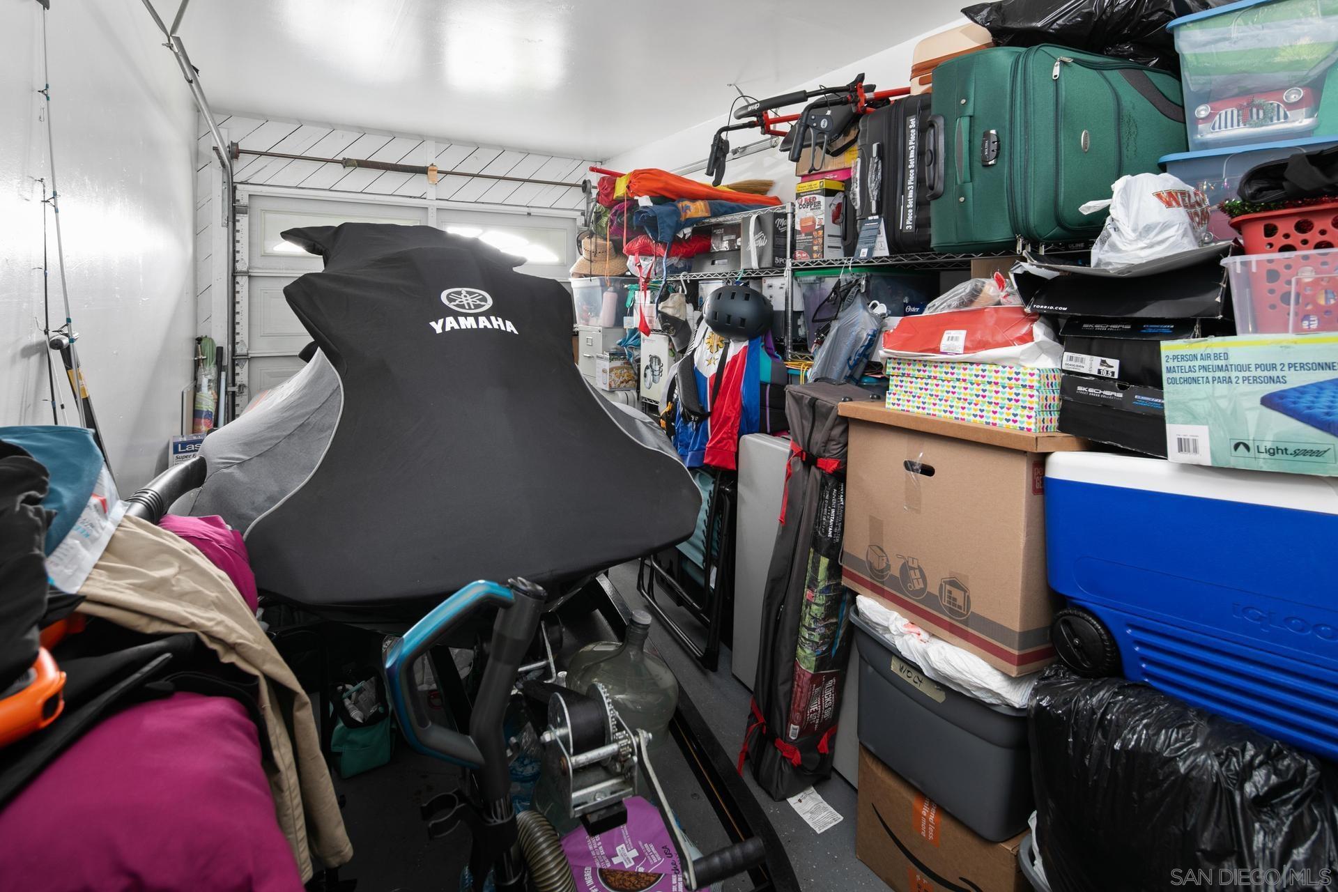 563 Madrona Street Chula Vista, CA 91910 - Photo 23 of 41 a view of walk in closet with clothes and shoes