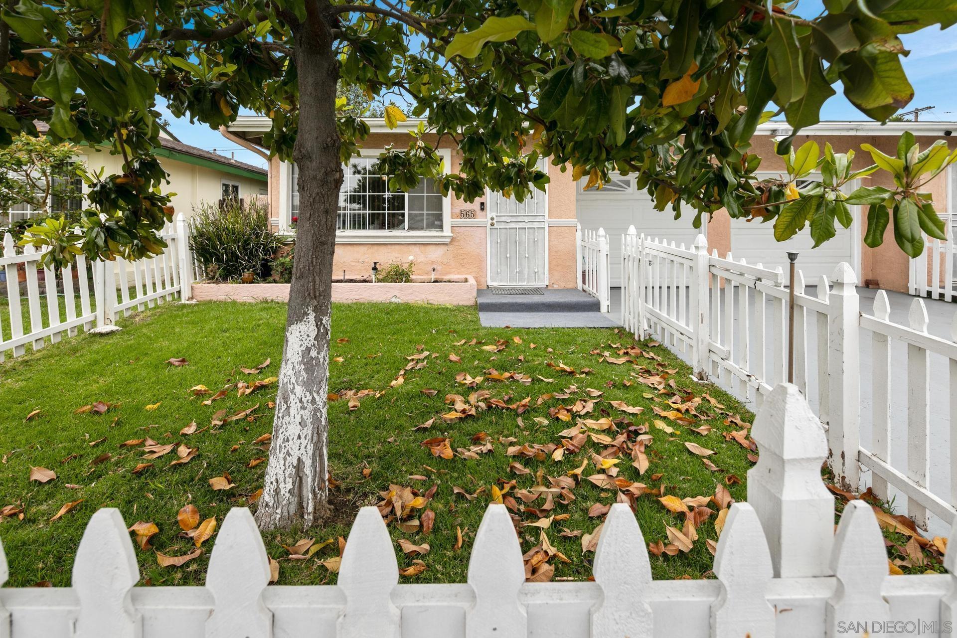 563 Madrona Street Chula Vista, CA 91910 - Photo 24 of 41 a view of a yard with plants and large trees