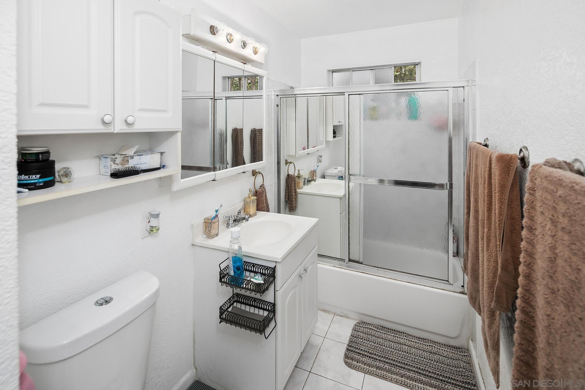 563 Madrona Street Chula Vista, CA 91910 - Photo 31 of 41 a bathroom with a sink toilet and shower