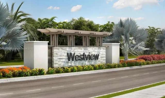 a view of a house with a yard and plants